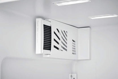 Air conditioning vent on a white wall with visible brand logo
